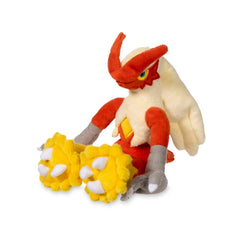 Pokémon Center Blaziken Sitting Cuties Plush sits upright on a desk for display.