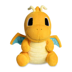 Dragonite plush with embroidered details brightens a shelf.