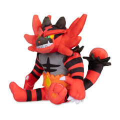 Pokémon Center Incineroar Sitting Cuties plush sits up on a desk for playful display.