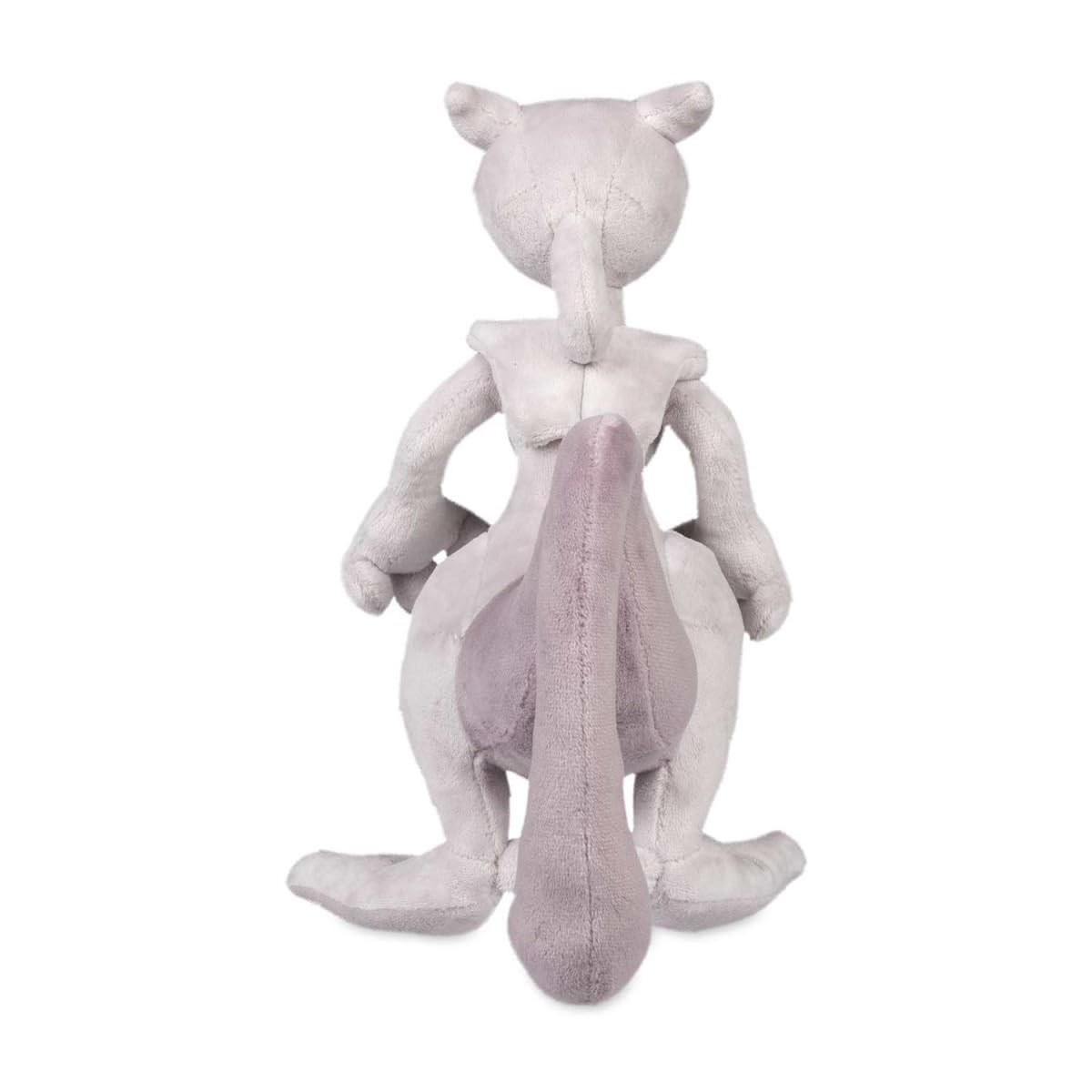 Pokémon Center Mewtwo plush on desk demonstrating compact size for desk setup