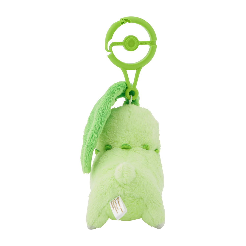 Pokémon Center Chikorita plush with size reference and portable weight for travel.