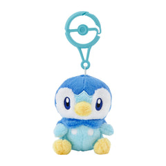 Pokémon Center Piplup plush with carabiner clipped to a backpack for on-the-go charm