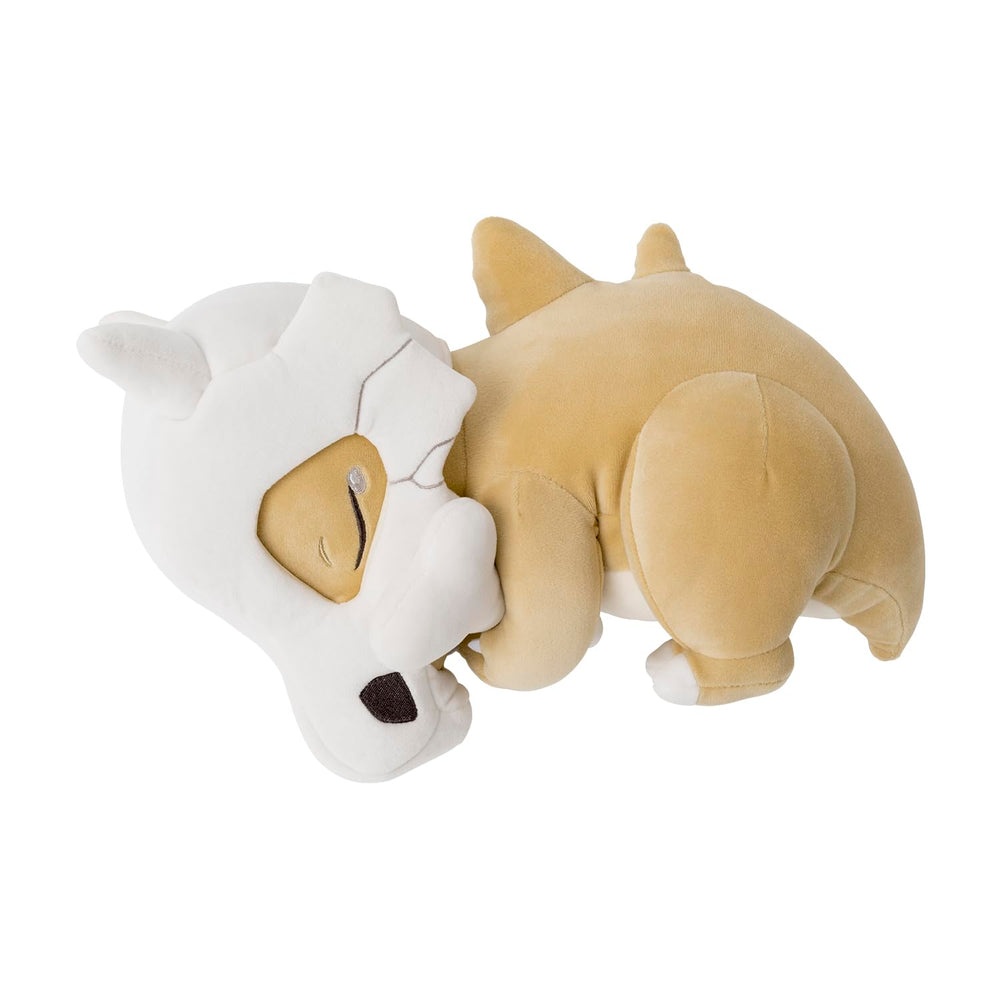 Pokémon Center Sleep Goodnight Cubone Plush hand-held view highlighting soft fabric for gentle hugs.