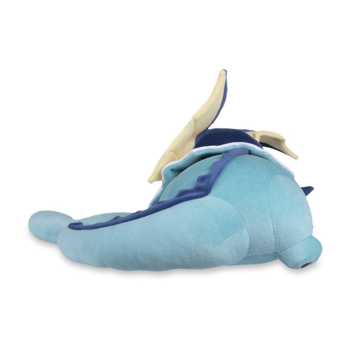 Pokémon Center Sleeping Vaporeon plush on bed, a cozy bedside companion