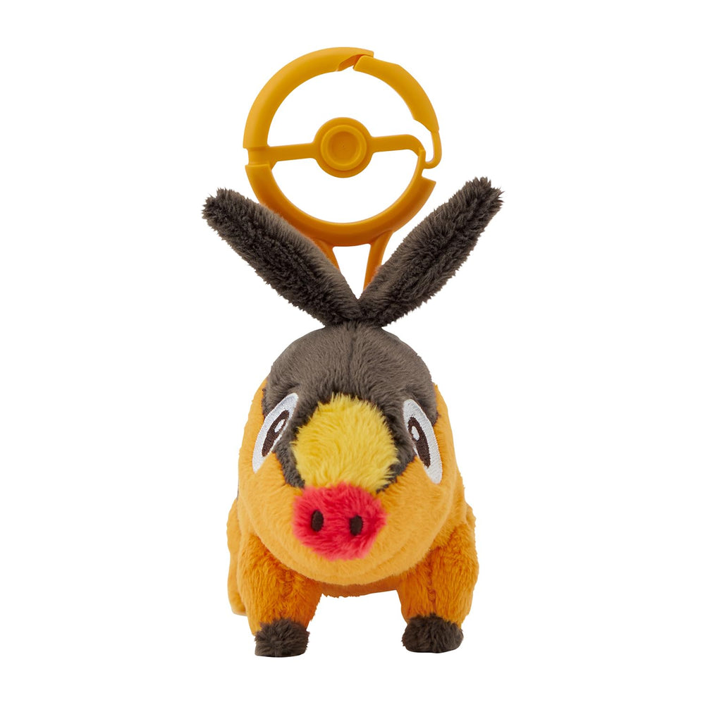 Pokémon Tepig plush with carabiner close-up showing soft texture and clip.