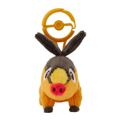 Pokémon Tepig plush with carabiner close-up showing soft texture and clip.