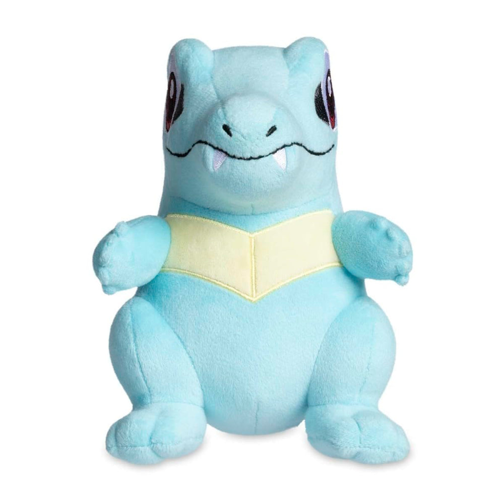 Pokemon Center Totodile plush side view highlighting embroidered features for durable cuddling.