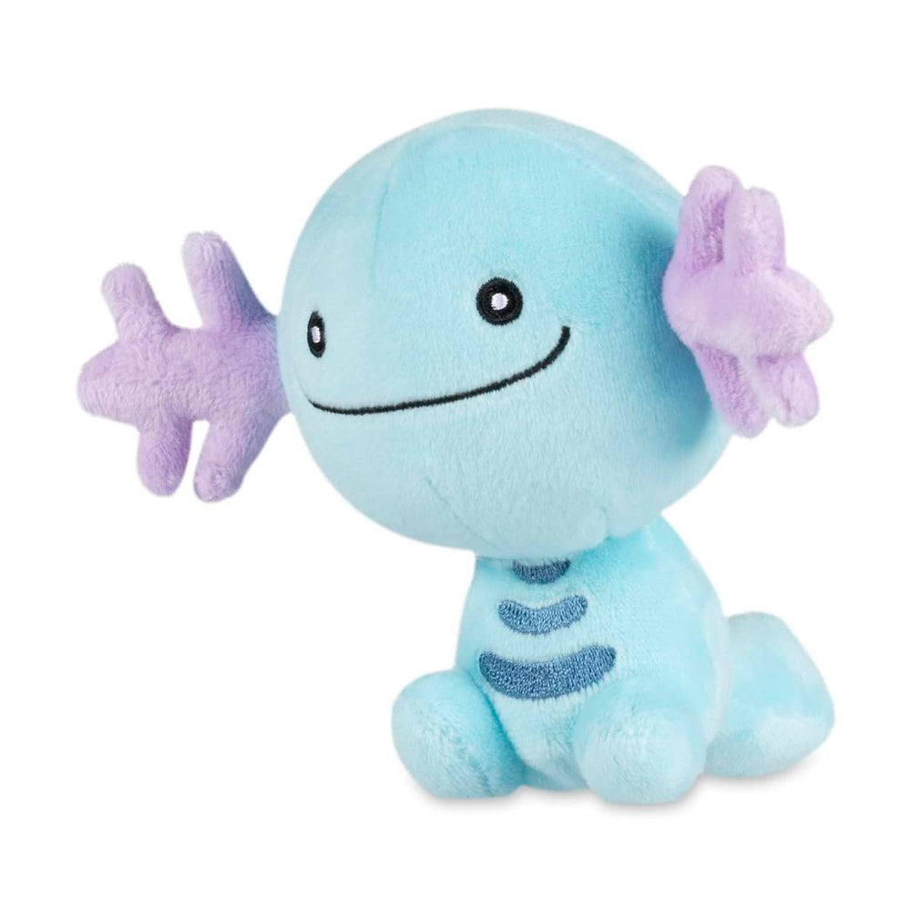 Pokémon Center Wooper Sitting Cuties Plush sits upright on a desk for a cute desk buddy