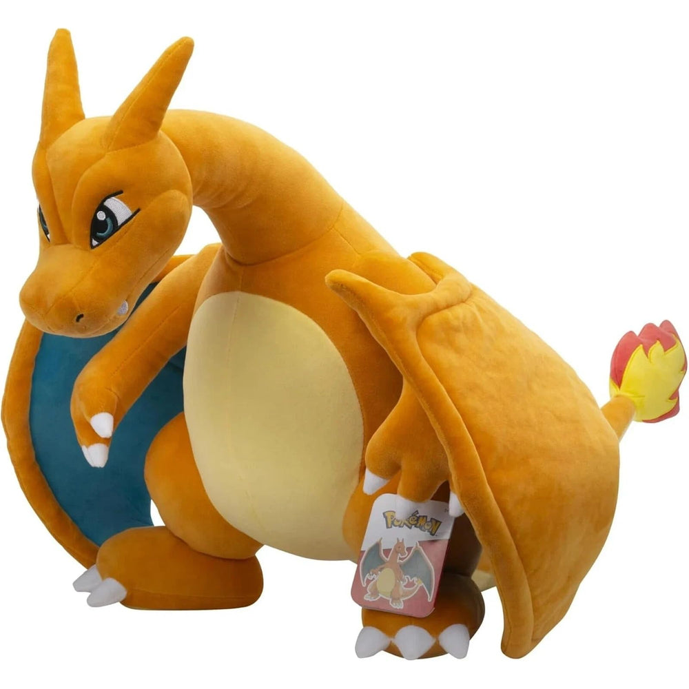Pokemon Charizard plush texture close-up shows soft polyester fabric.