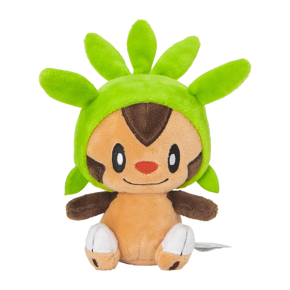 Pokémon Chespin Sitting Cuties plush upright on desk for charming desk decor.