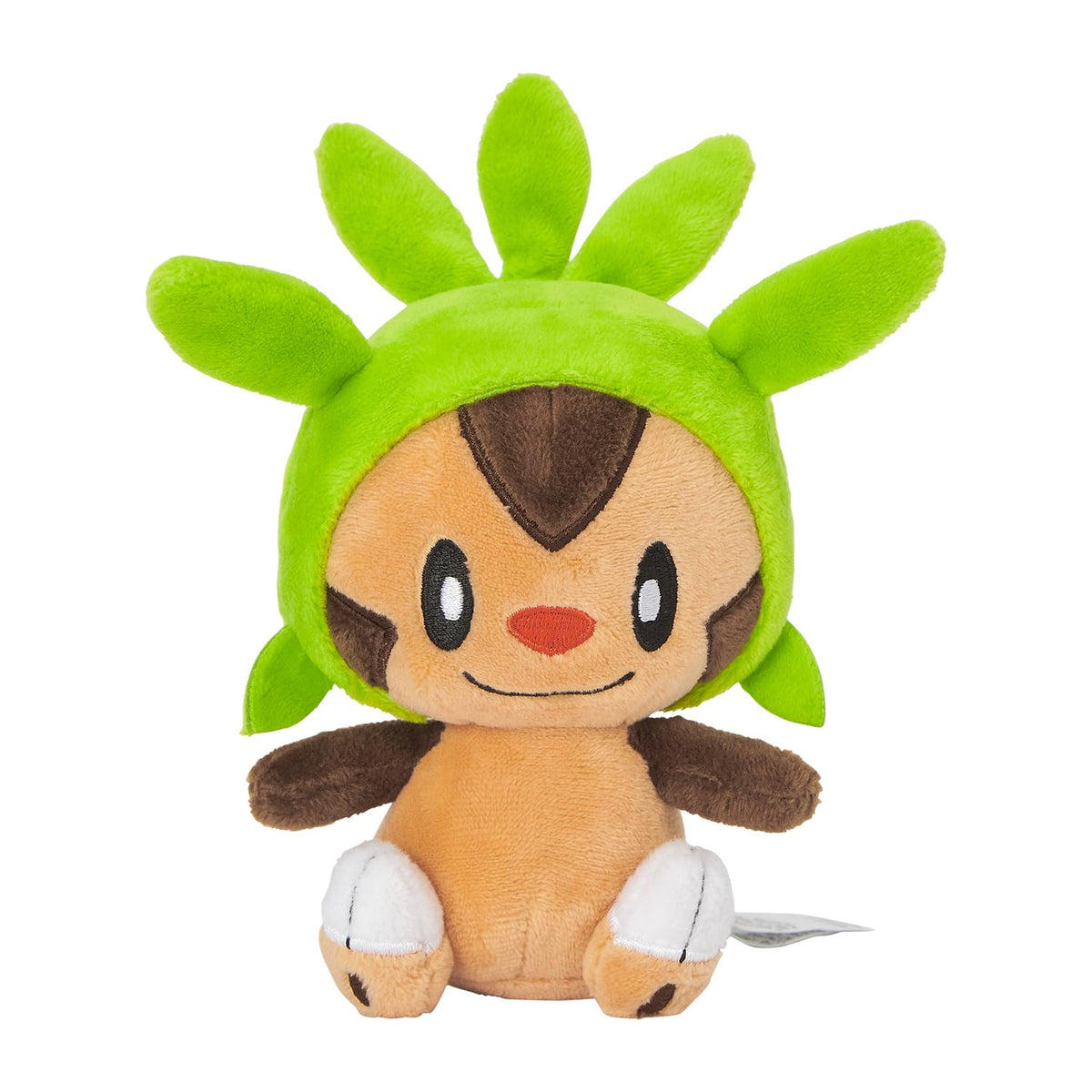 Pokémon Chespin Sitting Cuties plush upright on desk for charming desk decor.