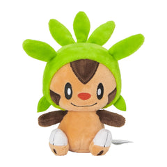 Pokémon Chespin Sitting Cuties plush upright on desk for charming desk decor.