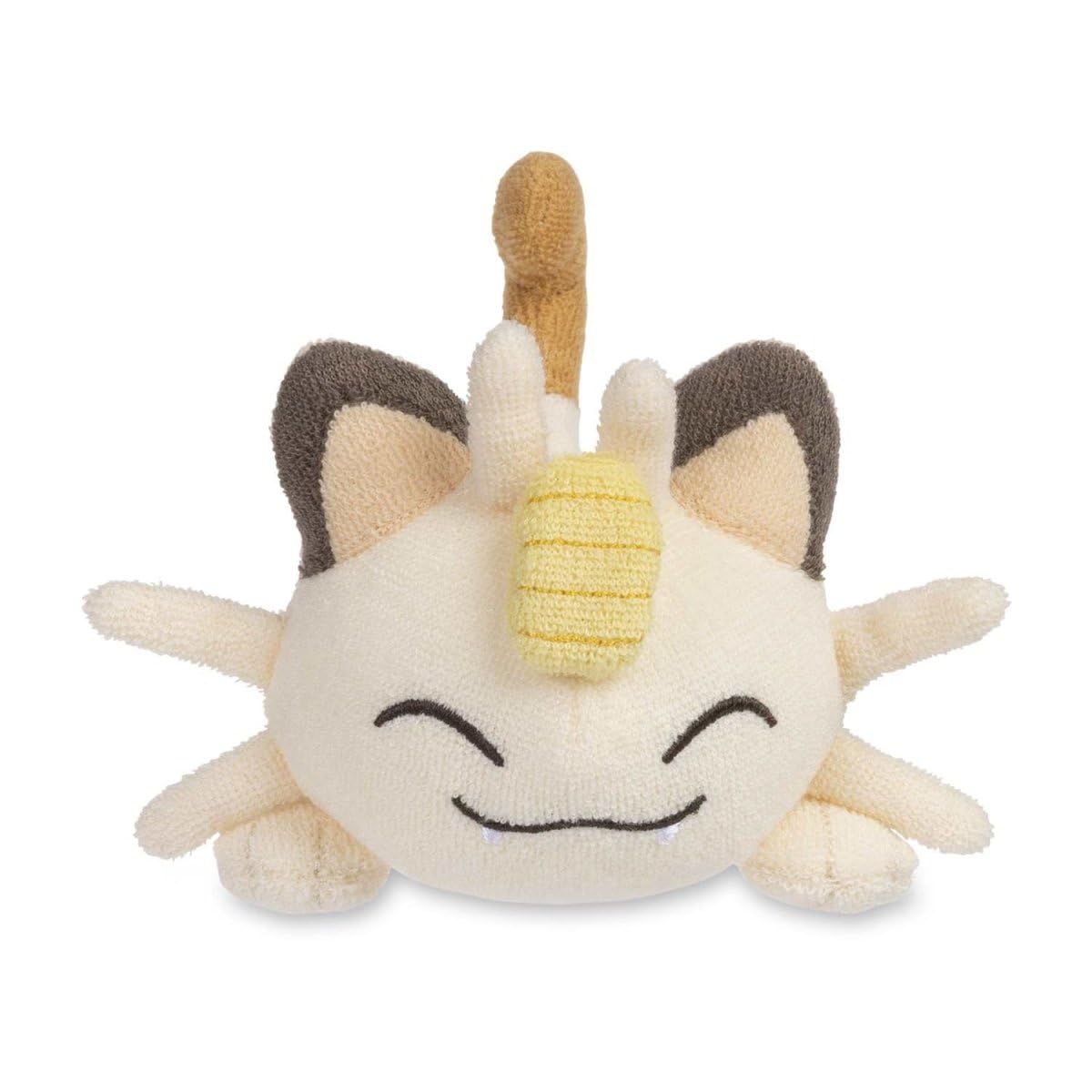 Pokemon Center Meowth Comfy Cuddlers plush side view highlights compact size for travel.