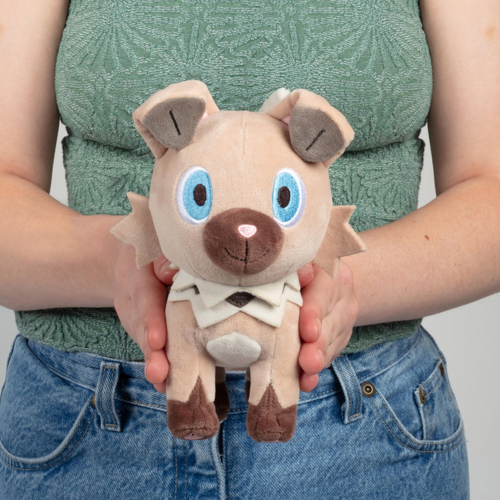 Pokémon Rockruff plush 8-inch in hand, ideal gift for Pokémon fans.