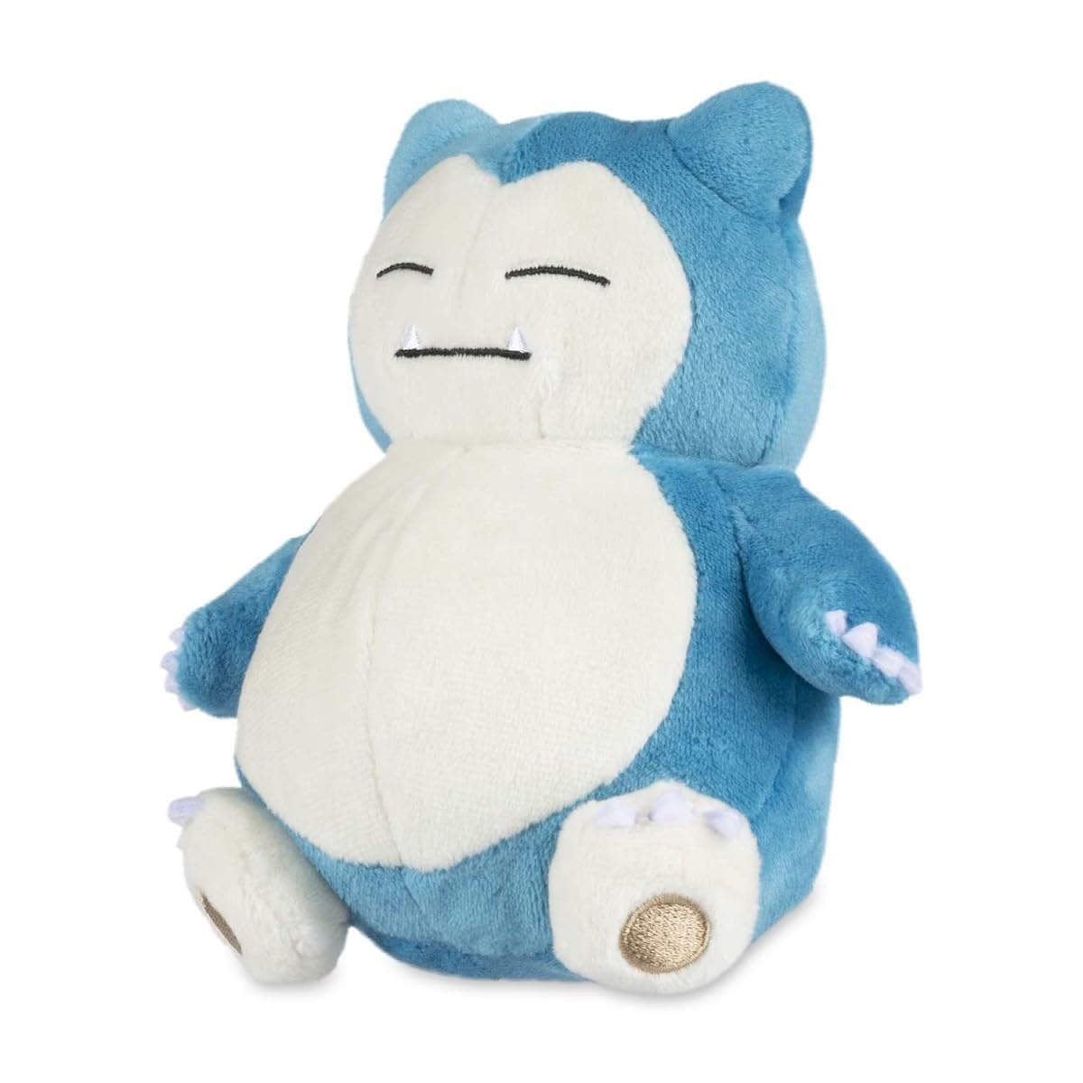 Pokémon Snorlax Sitting Cuties Plush resting upright on a desk for cute desk décor.