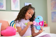 Polly Pocket baby seahorse in daddy's pouch creates cuddly play moments.