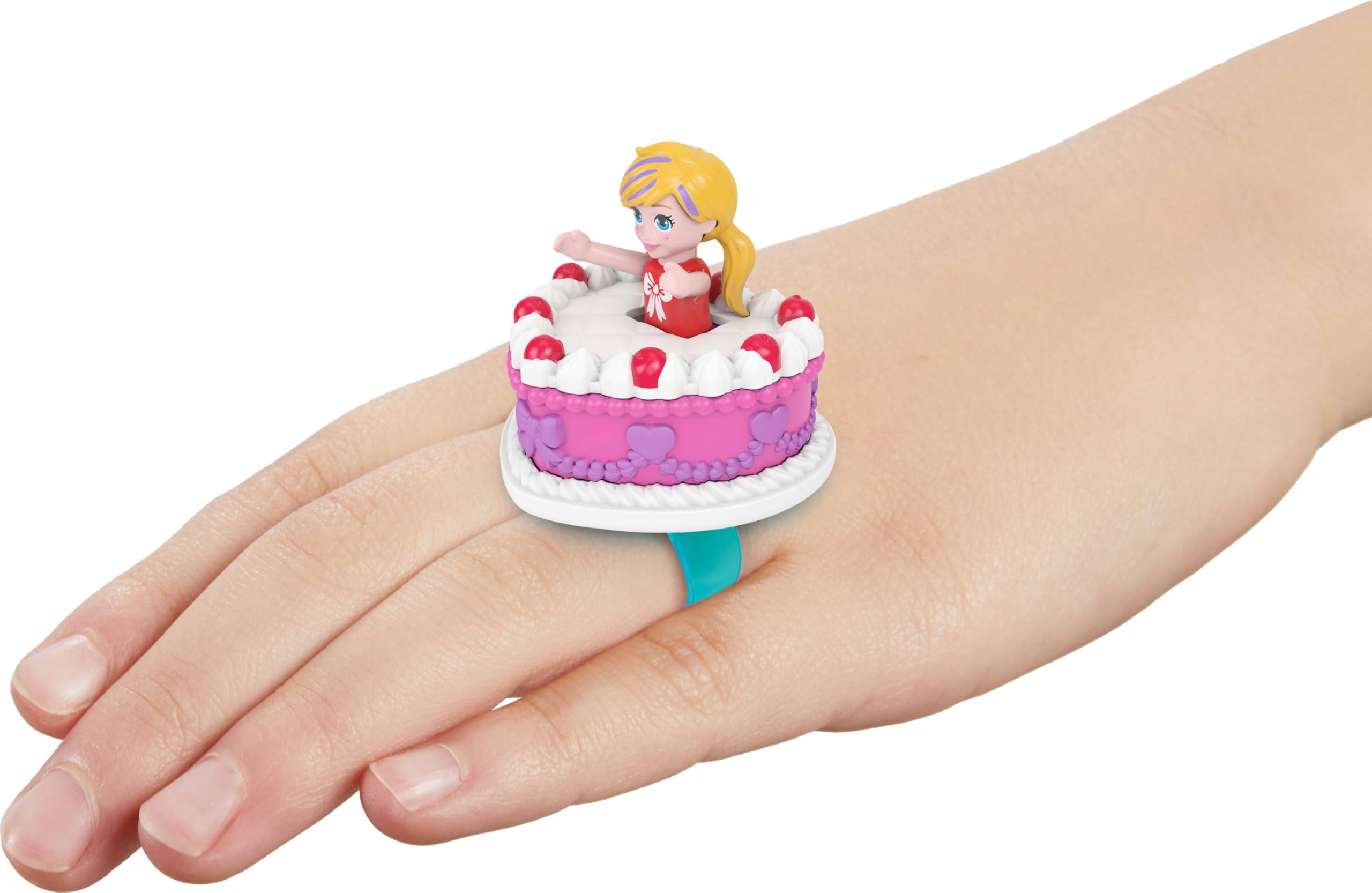 Polly Pocket doll sitting inside the compact supports portable, kid-friendly adventures.