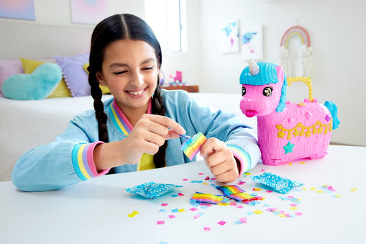 Polly Pocket dolls with party accessories encouraging cooperative, creative storytelling.