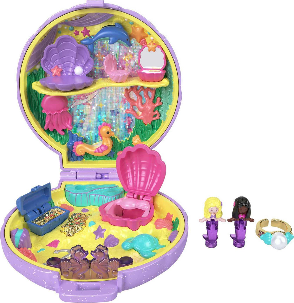 Polly Pocket Mermaid Dreams compact opens to reveal an underwater scene with mermaids and treasure.