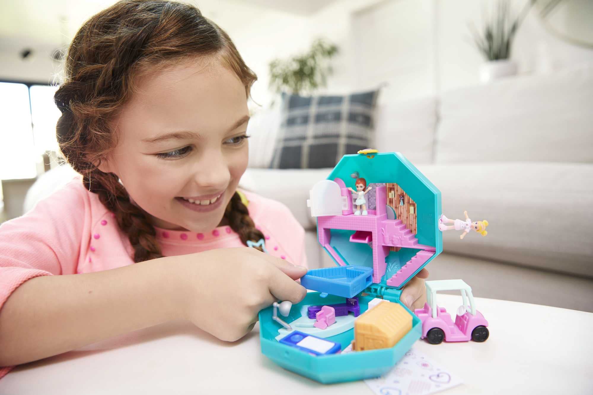 Polly and Lila dolls ride the Pamperin Perfume Spa golf cart for spa treatments