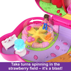 Polly Pocket strawberry house and fountain for cozy outdoor play scenes.