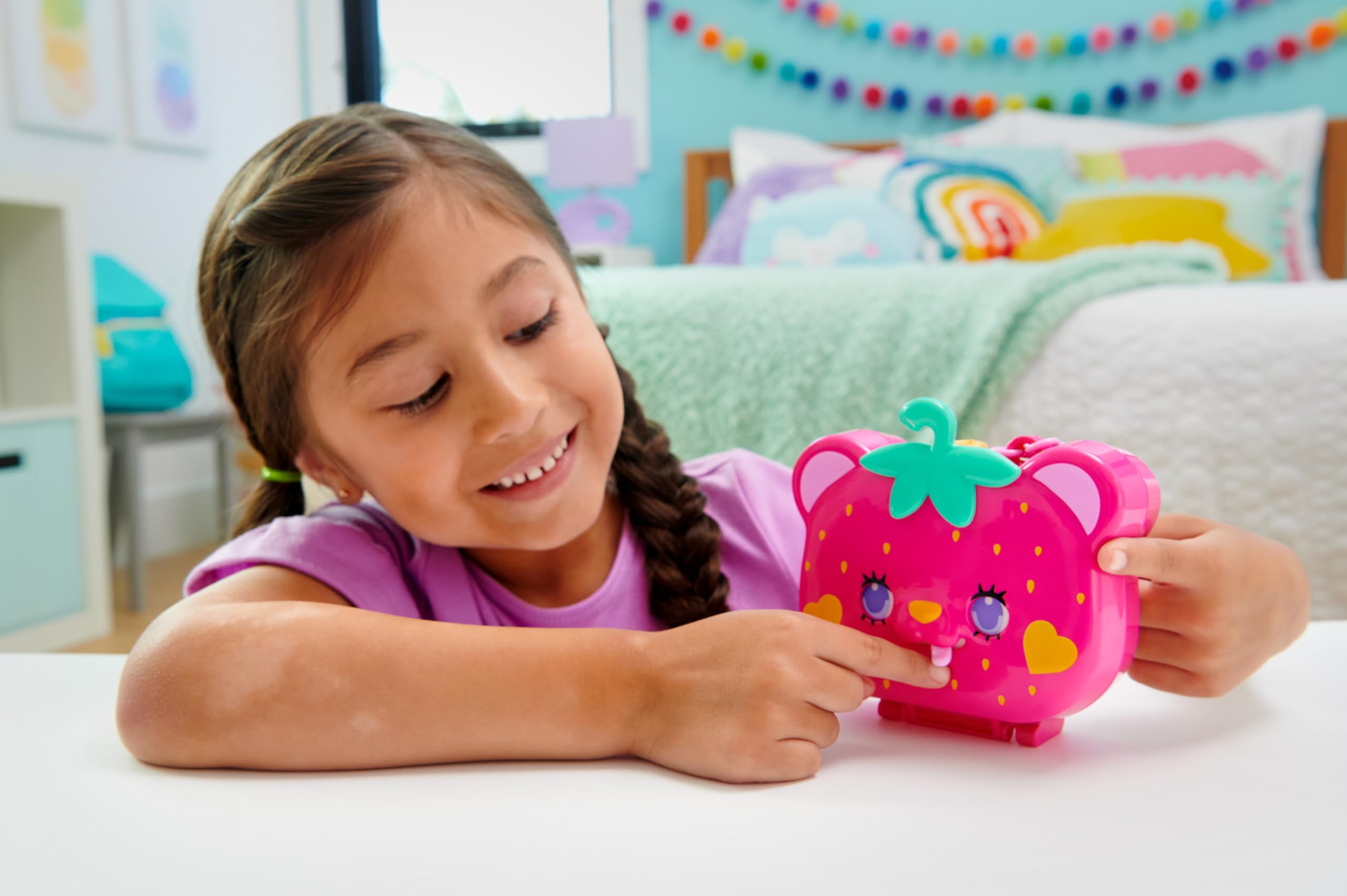 Polly Pocket two micro dolls inside the Straw-Beary Patch for imaginative storytelling.