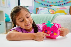 Polly Pocket two micro dolls inside the Straw-Beary Patch for imaginative storytelling.