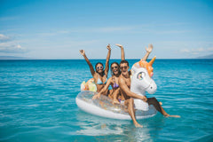 Top view of the PoolCandy Gigantic Unicorn raft with gold glitter finish.