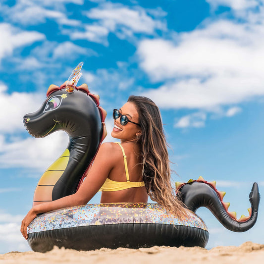 Poolcandy Sea Dragon Glitter 40in pool tube adds sparkle in sunlit water.