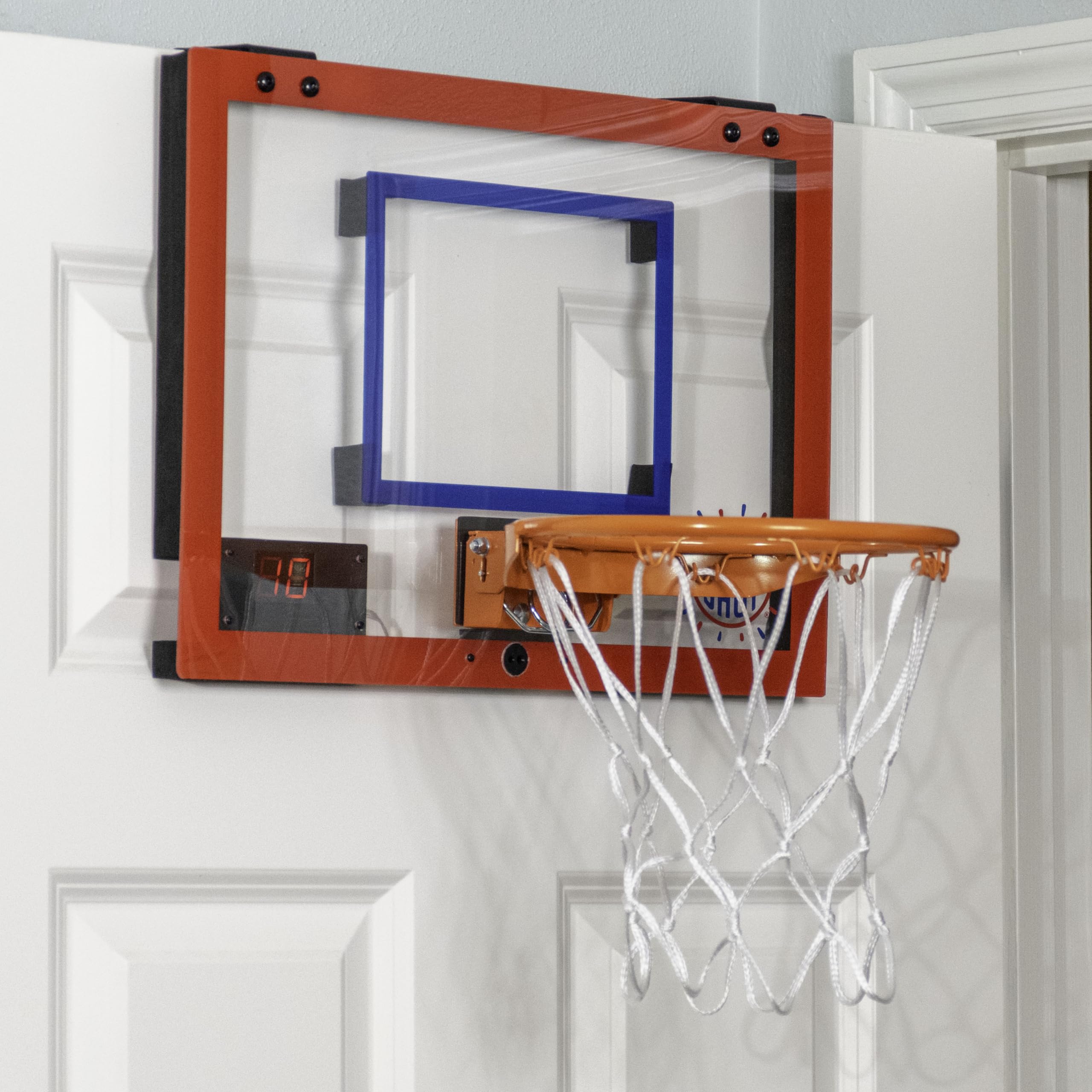 Pop-A-Shot Super Slam dunk action showcasing the durable rim in use.