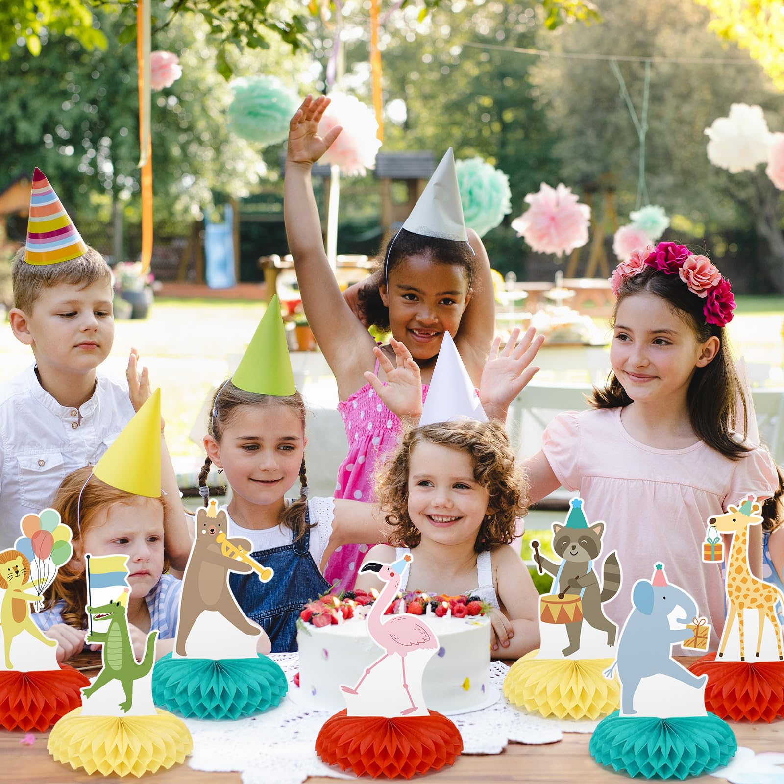 Potchen zoo-themed centerpieces create cohesive safari vibes on dessert tables.