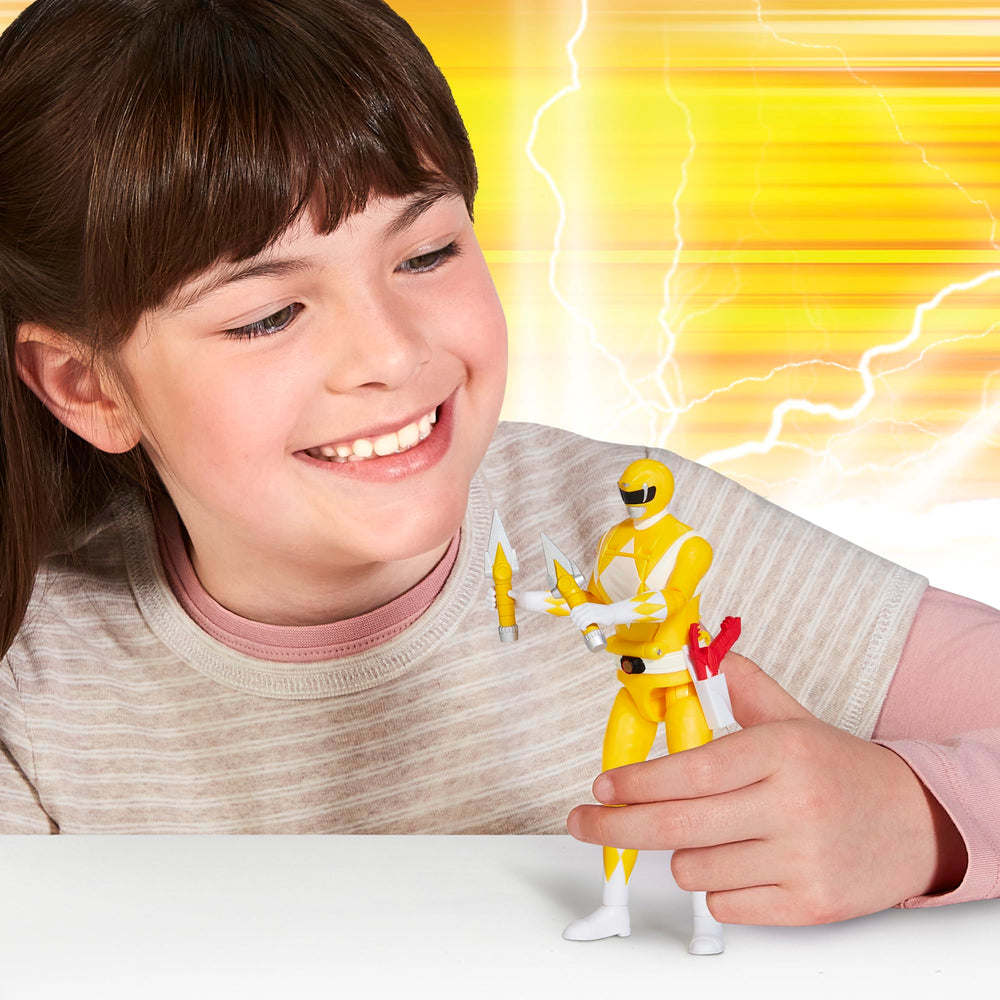 Close-up of Power Rangers Auto Morphin Yellow Ranger figure, detailed sculpt and vibrant colors for collectors.