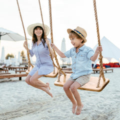 Premkid family-friendly backyard swing set in sunny garden setting.