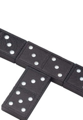 Close-up of engraved colorfast dots on Pressman dominoes for durable play.