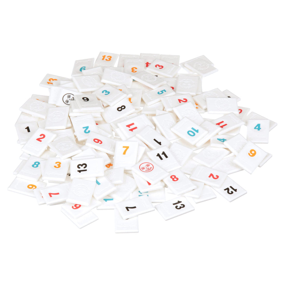 Pressman Rummikub Six Player Edition tiles arranged on table for strategy