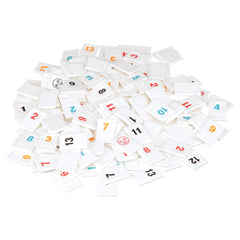 Pressman Rummikub Six Player Edition tiles arranged on table for strategy