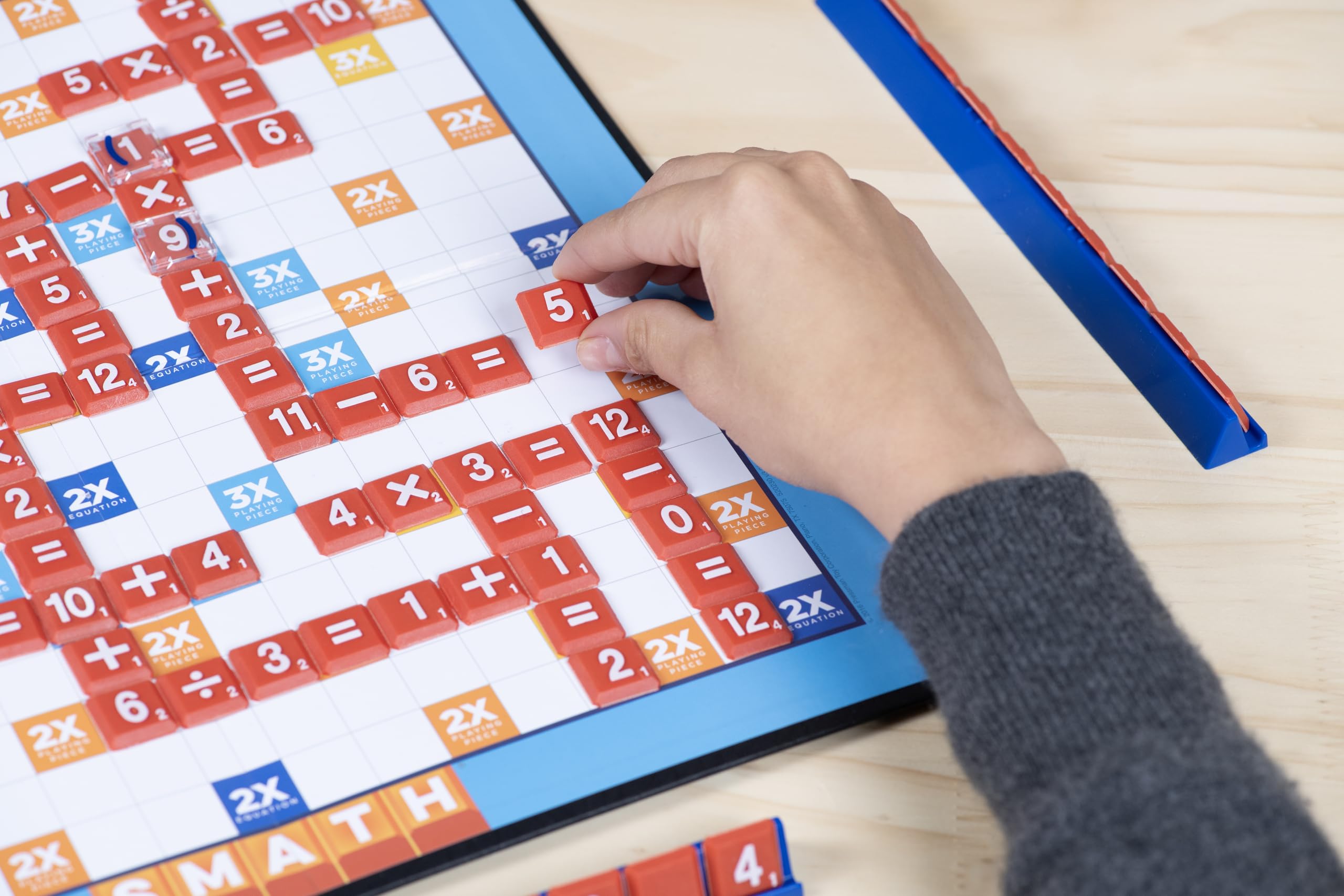 Smath pieces spread across the grid for quick equation-building.