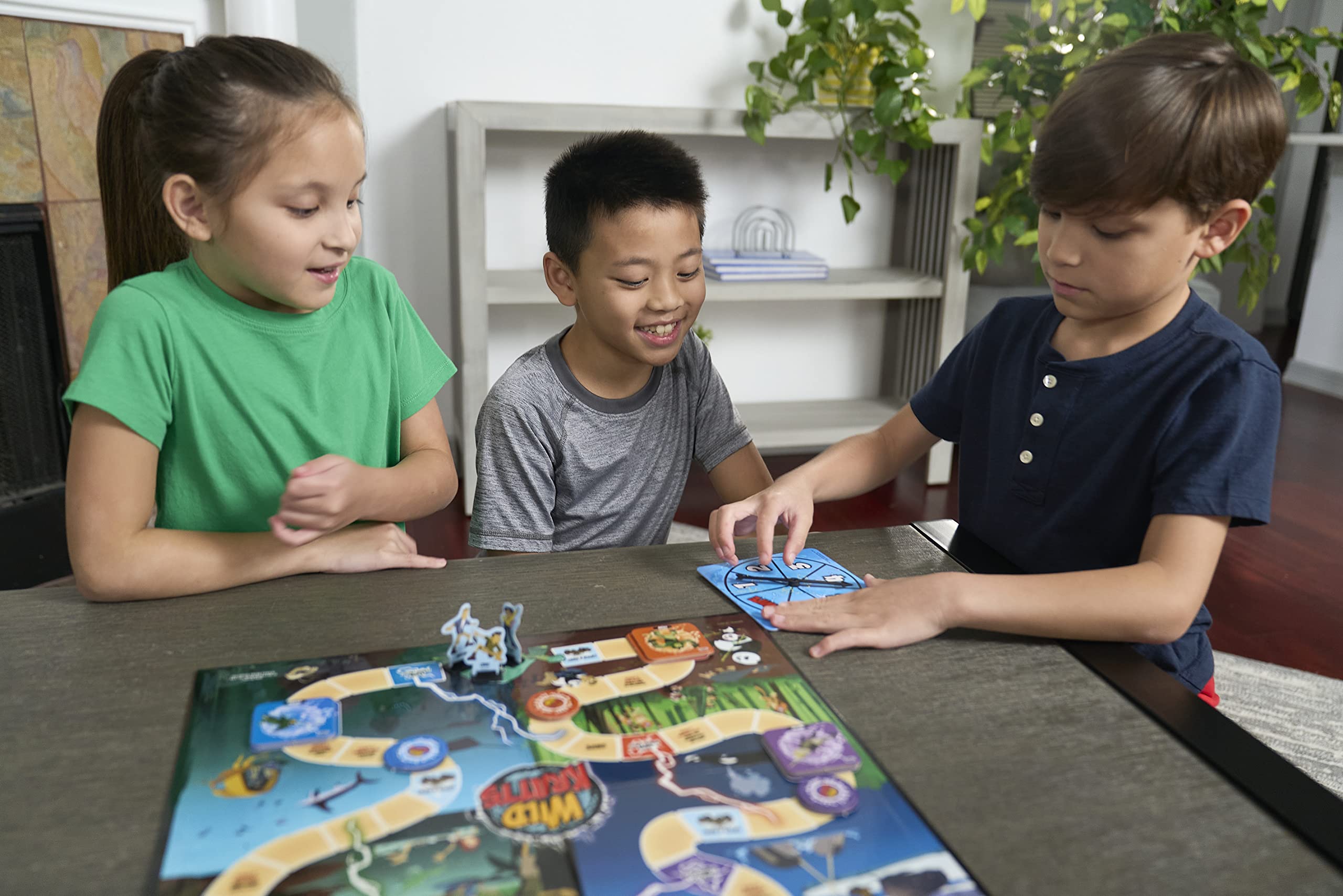 Pressman Wild Kratts Creature Power Suits cards spread during game play for strategic collection.