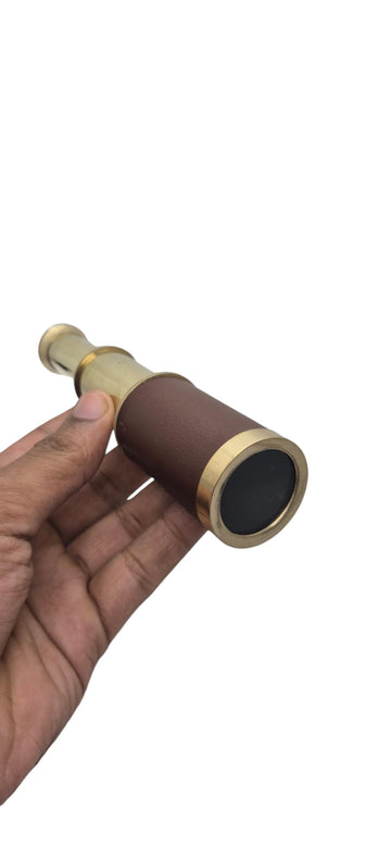 Prime NAUTICAL spyglass in use during trekking for distant landscape views