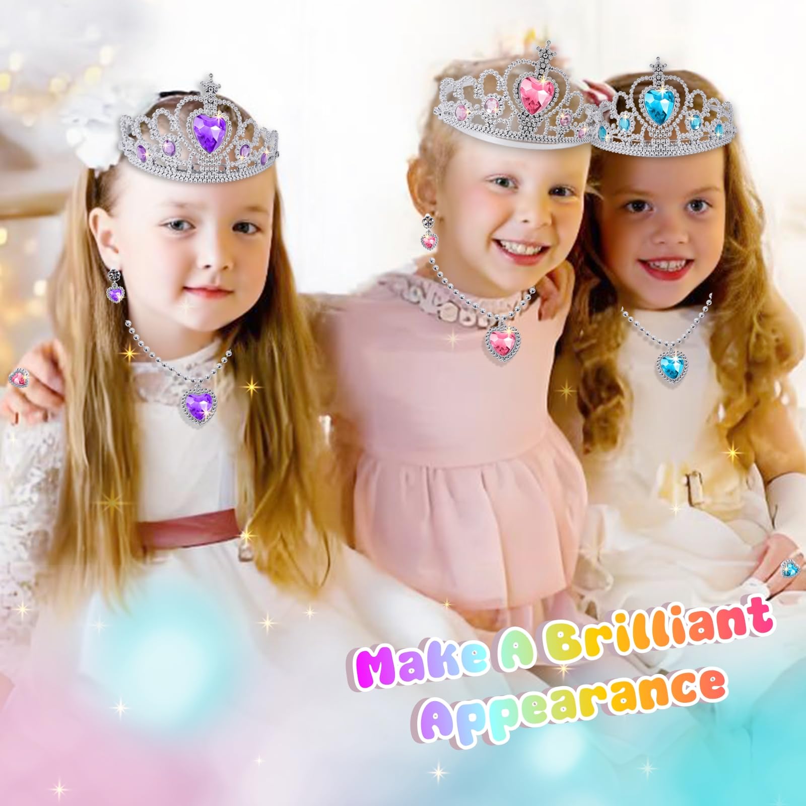 Three princess dresses in pink, purple, and blue on display