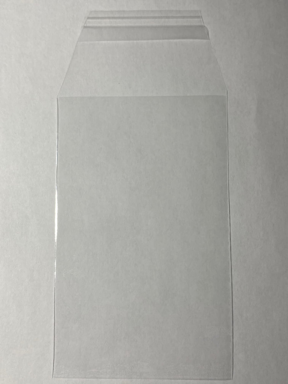 Close-up of tapered resealable lip on ProGuard Cards sleeves reduces scratches on graded cards.