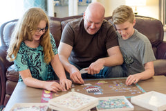 PUZZLE EZ space-saving design keeps puzzle pieces organized and accessible.