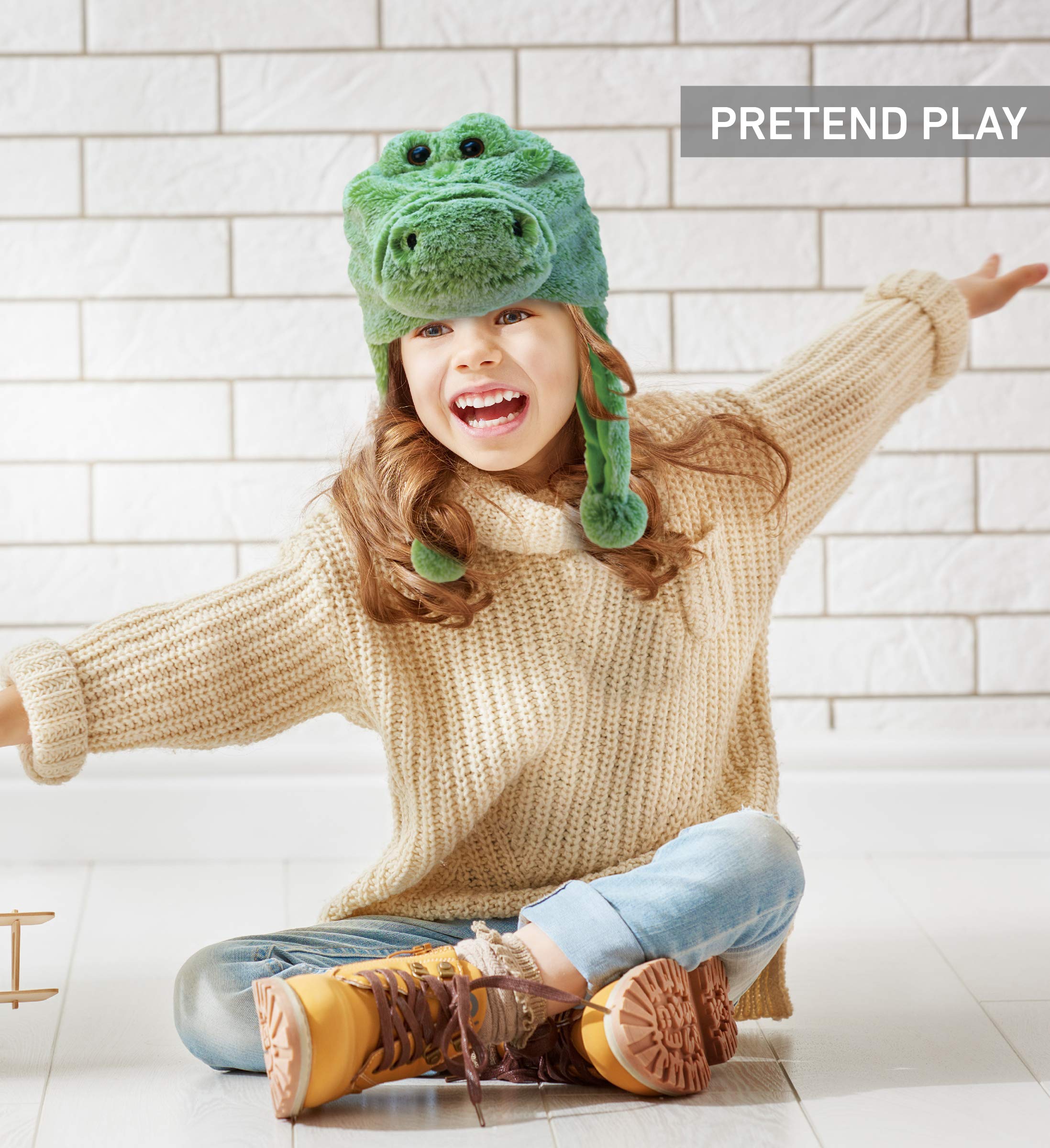 Puzzled DolliBu alligator plush hat worn by a happy child, stylish and cozy.