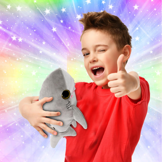 Puzzled plush shark snuggle side view encourages travel and bedtime stories.