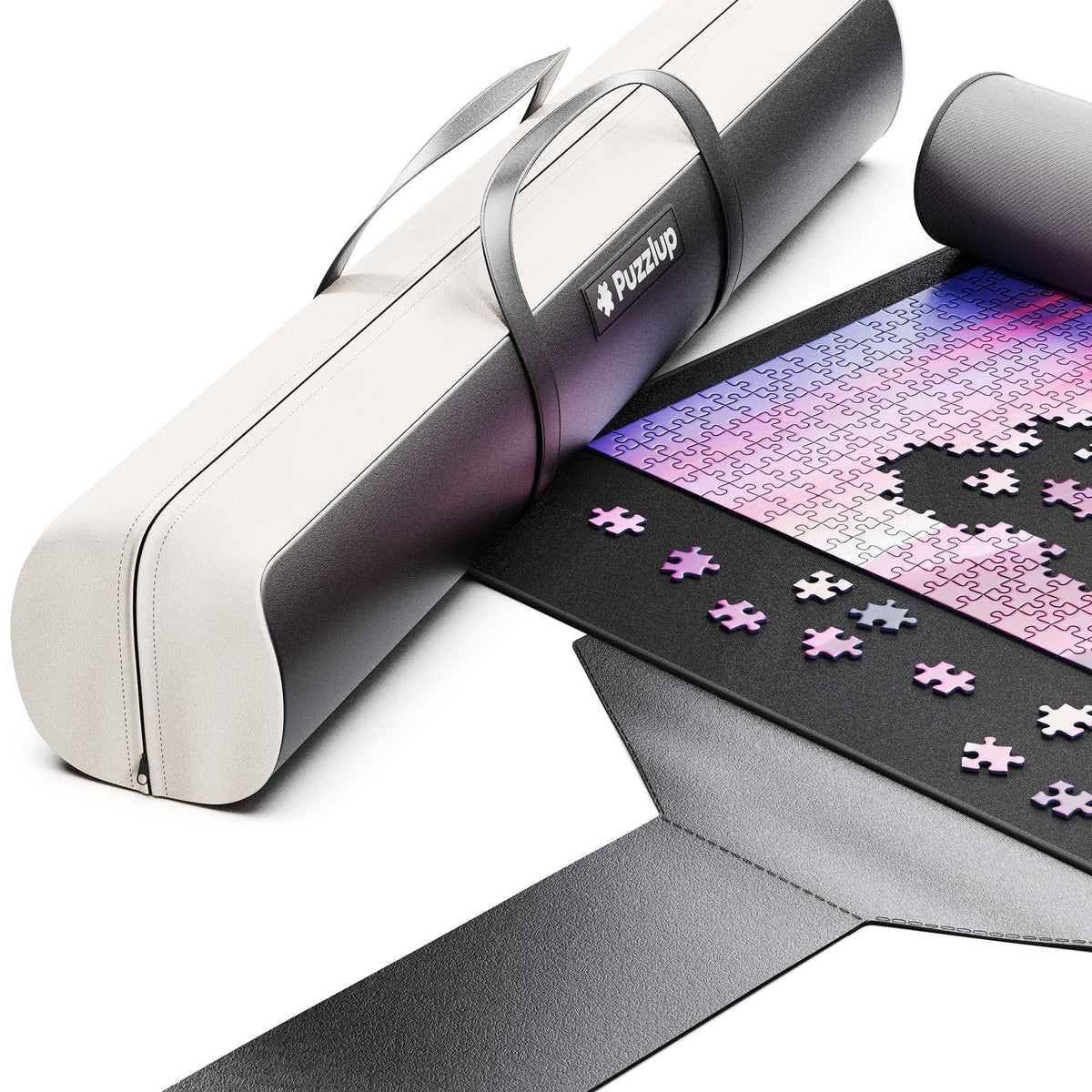 Puzzlup Luxury Puzzle Mat rolled with leather case for easy portability.