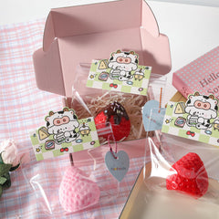 QCROAD SQUISHY big taba strawberry squishy in hand communicates large size for extended play.