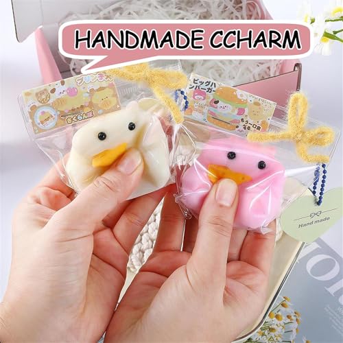 QCROAD SQUISHY Taba Hamster being squeezed demonstrates satisfying tactile sensation.