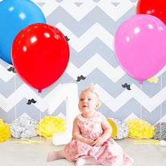 QIKOOLAA large red balloons for versatile decor and displays in photos.