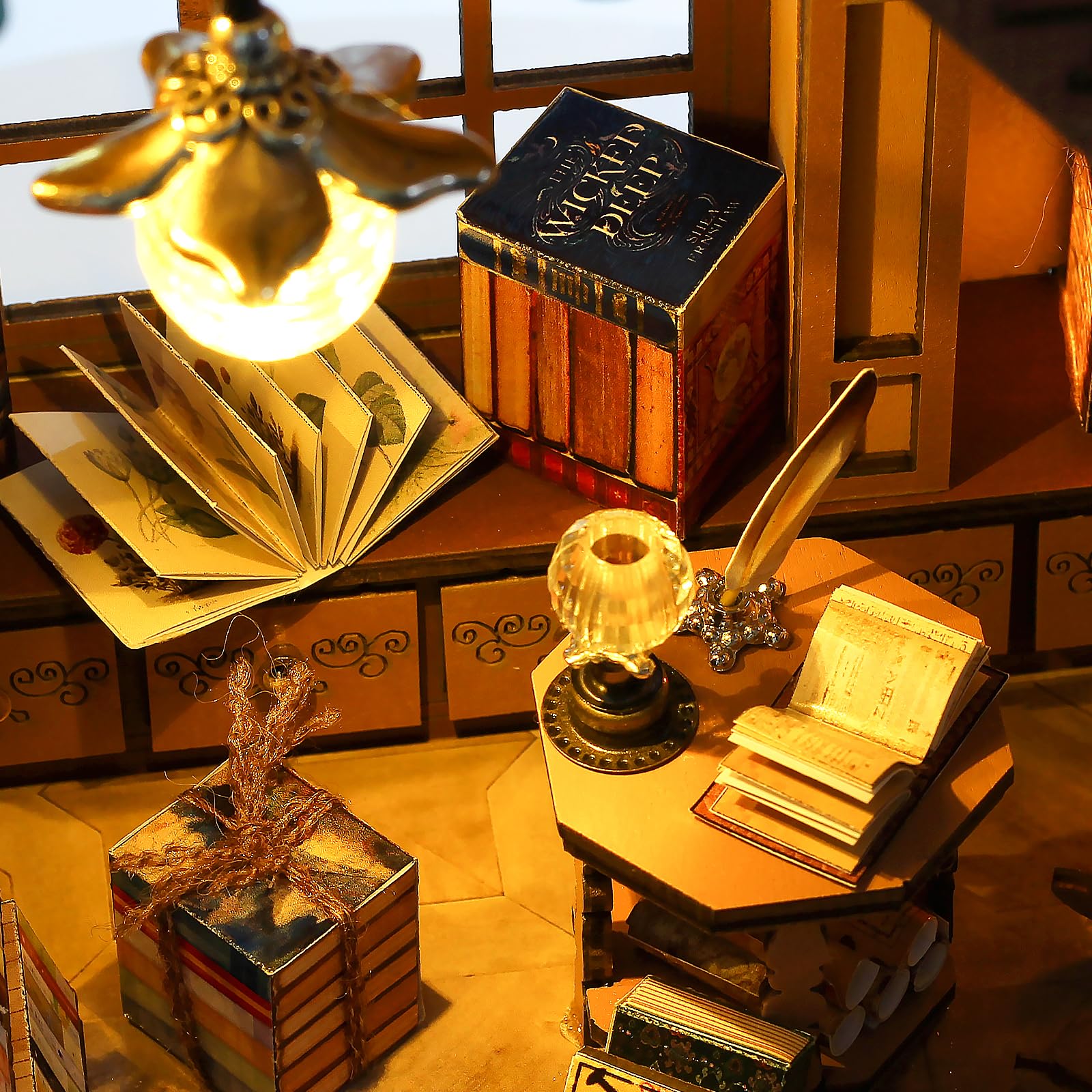 Quanquer book-store diorama with ancient books creates a cozy bookshelf focal point.
