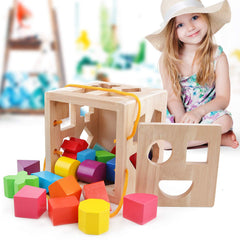 QZMTOY Toddler uses shape sorter for hands-on problem solving.